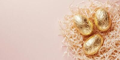 Elegant Easter minimalistic flat lay with golden eggs on shredded paper photo