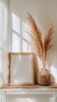 Bohemian style living room detail with frame and pampas grass decor photo