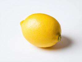 Bright fresh yellow lemon on clean neutral background for culinary design photo