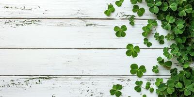Minimalistic white wooden surface with clovers design for spring decor or background photo