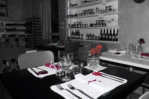 A black and white photo of a restaurant table