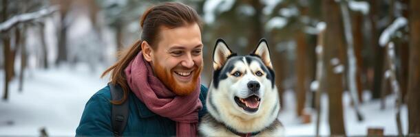 Smiling Man with Siberian Husky in Snowy Forest. Winter Adventure and Friendship Outdoors photo