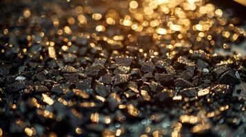 A collection of black stones glimmers under soft light, creating a mesmerizing pattern that captures the beauty of natural materials at dusk, highlighting textures and reflections. photo