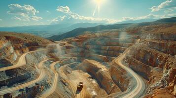 A vast open pit mine features heavy machinery navigating winding dirt roads, while the sun shines brightly above distant mountains and clouds creating an expansive sky. photo