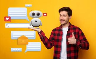 Man stands against a vibrant yellow background, holding a small robot representing a virtual assistant. Chat bubbles and icons symbolize interactions with artificial intelligence software. photo