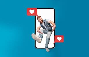A young man playfully interacts with a smartphone displaying heart messages, showcasing the connection between love and technology in a fun, modern context. photo