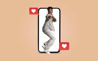 A person joyfully interacts with a smartphone, expressing enthusiasm and love. The backdrop emphasizes a theme of social media connections, perfect for Valentines Day. photo