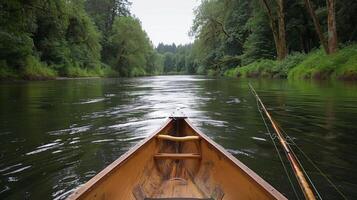 Rowing through calm waters, a canoe glides quietly along a river bordered by thick forests, creating a tranquil atmosphere ideal for relaxation and fishing. photo