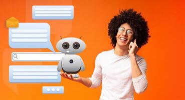 A young African American guy smiles while engaging with a friendly virtual assistant on orange background. Conversation bubbles appear, highlighting AI's role in communication and support. photo
