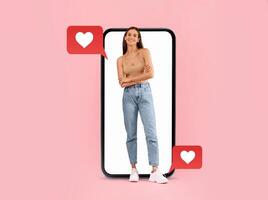 A person stands confidently with arms crossed inside a smartphone frame. Heart icons emerge from messages, symbolizing love and connection. photo
