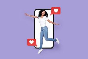 A cheerful person jumps in excitement while interacting with a smartphone. Text messages with heart symbols suggest love and social media activity. The vibrant background adds to the lively mood. photo