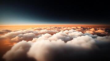 A breathtaking aerial view of soft clouds illuminated by a warm sunset over the horizon photo