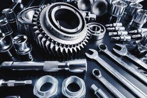 Tools and gears arranged on a workbench showcasing precision engineering and craftsmanship in a workshop setting photo