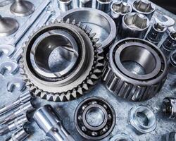 Various mechanical components arranged on a workbench for repair activities in a workshop setting photo