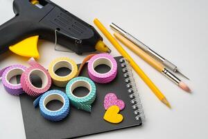 Crafting supplies and tools arranged on a workspace ready for creative projects photo