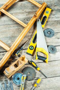 Tools and wooden structure on a workbench ready for assembly in a workshop photo