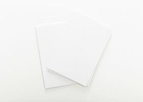 Blank sheets of white paper stacked on a clean surface ready for creative projects and note-taking at any time photo