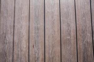 Wooden planks arranged in a rustic pattern showcasing natural grain and texture in soft lighting photo