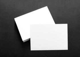 Blank cards on a dark surface for creative projects and personalized messages in a minimalist style photo