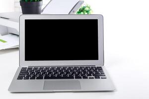 Modern laptop placed on a clean workspace with minimal decor and focus on technology photo