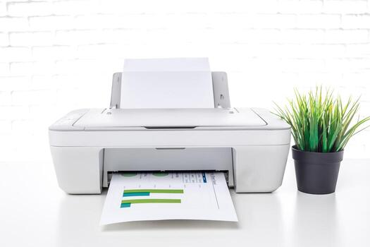 Printer in a bright office environment producing printed documents with colorful charts and graphs photo