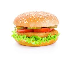 Delicious crispy chicken burger with fresh vegetables served on a sesame seed bun photo