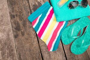 Summer beach essentials laid out on wooden surface for a fun day in the sun photo