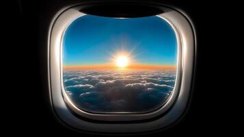 A breathtaking sunrise viewed from an airplane window above the clouds during flight photo
