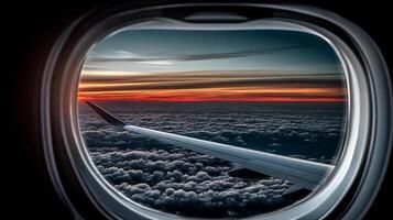 A breathtaking view of a sunset from an airplane window, showcasing vibrant clouds and a wing photo