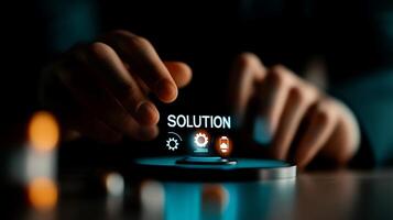 A close-up of hands interacting with a digital interface displaying the word 'SOLUTION' and icons, symbolizing problem-solving in a modern workspace photo