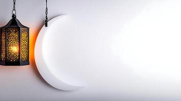 A decorative lantern hanging beside a crescent moon against a soft white background, creating a serene atmosphere photo