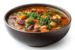 Minestrone soup with parsley, beans, and vegetables in a bowl photo