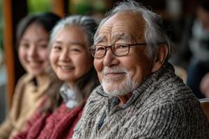 Portrait of smiling senior man with his family members in background photo