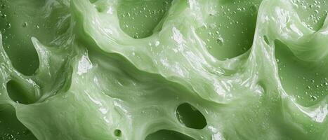 Close up of a green, glossy, and textured surface photo