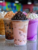 A variety of bubble tea drinks with different toppings photo