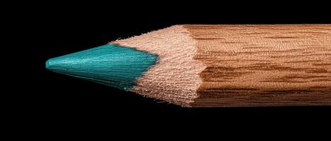 Close up of a sharpened teal colored pencil photo