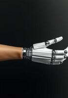 A robotic arm extends from a human arm, symbolizing technology and the future photo