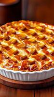 National Pie Day caramel apple pie drizzled with caramel sauce with warm tones and rustic wooden accents photo