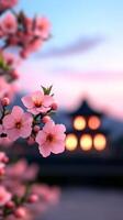 Tet background with a pagoda lit by soft lanterns at sunset framed by pink peach blossoms and yellow apricot flowers photo