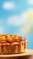 National Pie Day background showcasing a caramel apple pie drizzled with caramel sauce with warm tones and rustic wooden accents photo
