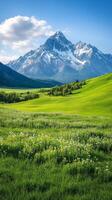 A spring mountain backdrop with rolling green hills colorful wildflowers and snow capped peaks photo