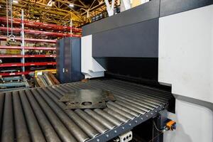 Modern metal sheet forming machine at the metalwork factory photo