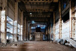 Old broken empty abandoned industrial hall photo