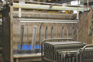 Close-up of a factory interior, industrial equipment and machinery. Complexity of modern manufacturing, network of pipes, tanks, and structures. Concept of industry, production or technology photo