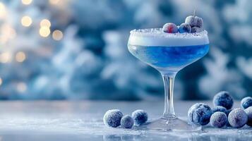 A blue cocktail with berries on a snowy background photo