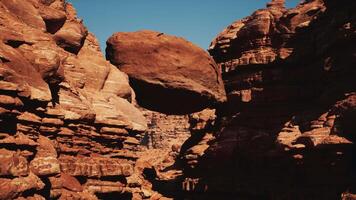 A large rock formation in the middle of a desert video