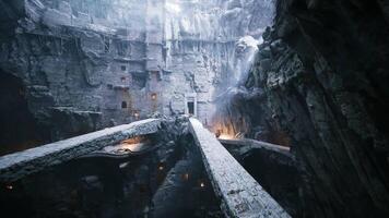 Mysterious underground cave with stone bridges and glowing openings video