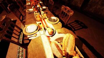 A banquet table filled with various foods and drinks set for a feast video