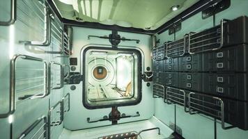 Interior of a futuristic space station module with storage and large window video