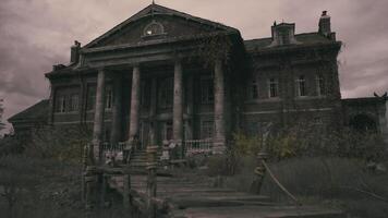 Abandoned mansion with classical architecture and overgrown surroundings video